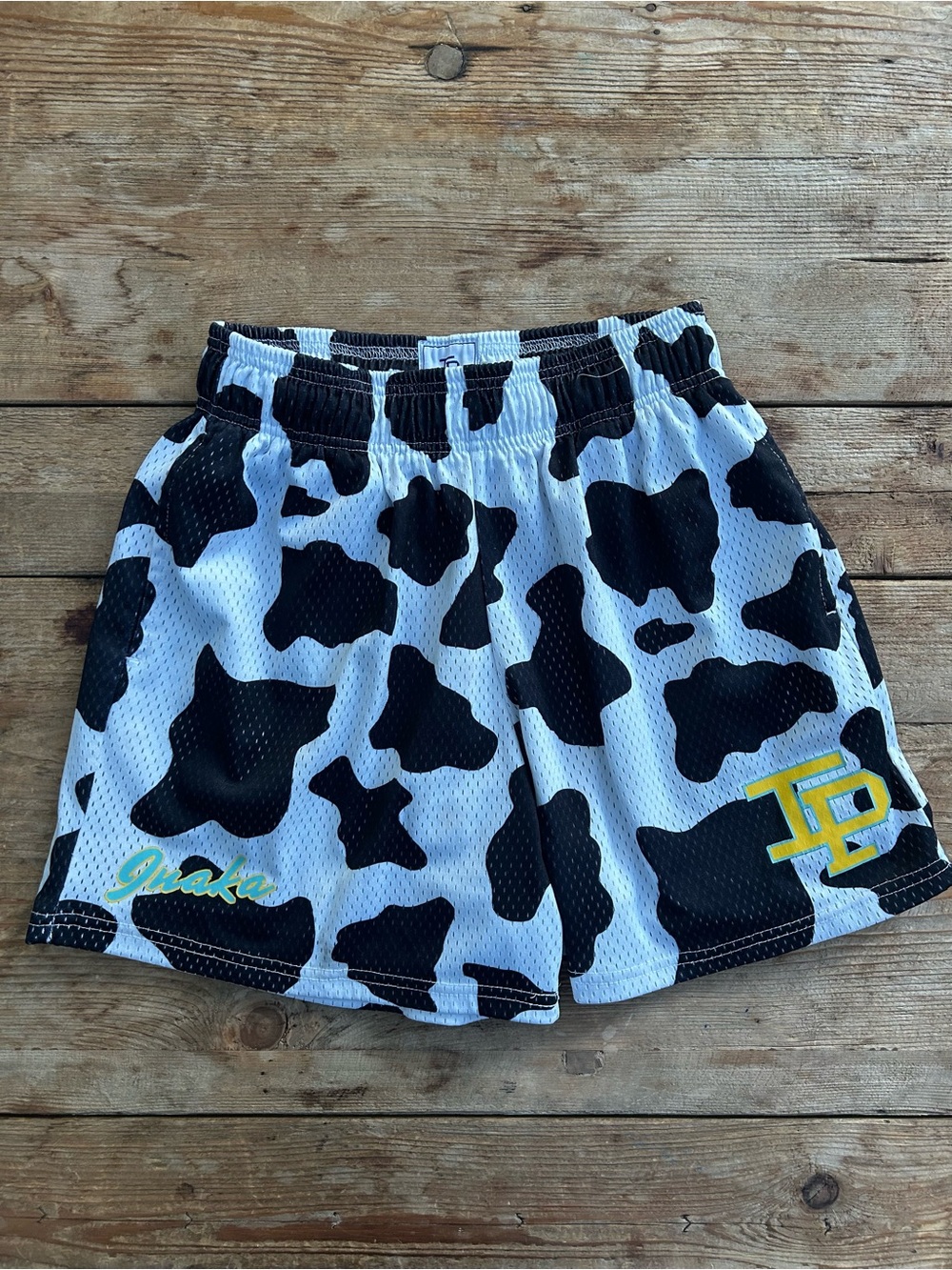 Inaka Power Black and White Cow Print Athletic Shorts